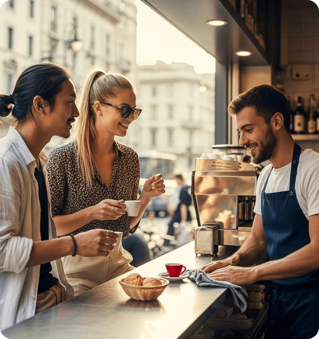 A young couple orders espresso and baked goods from a barista at an Italian café.